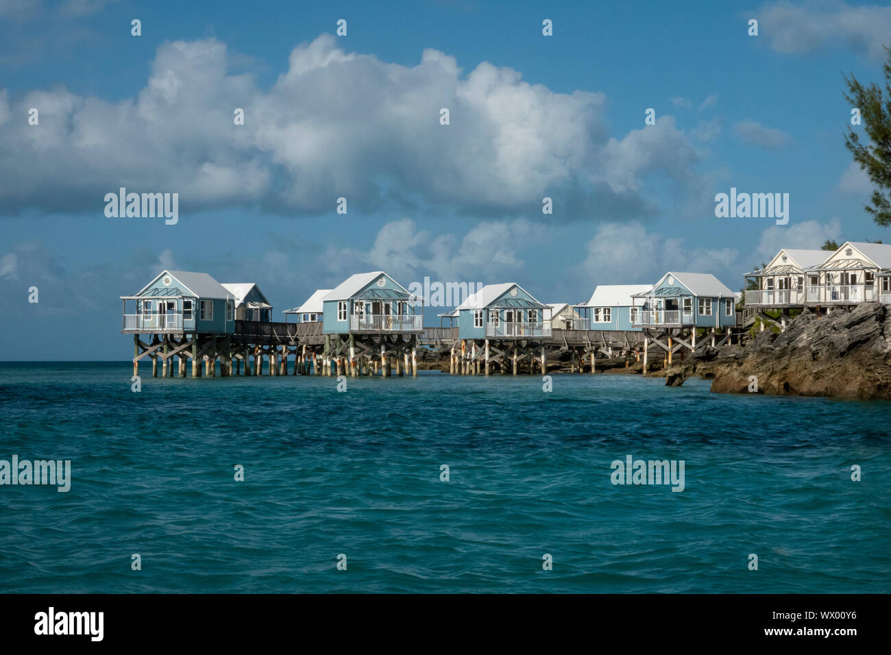 The abandoned 9 Beaches resort in Somerset Bermuda showing beach huts on stilts in the ocean Stock Photo