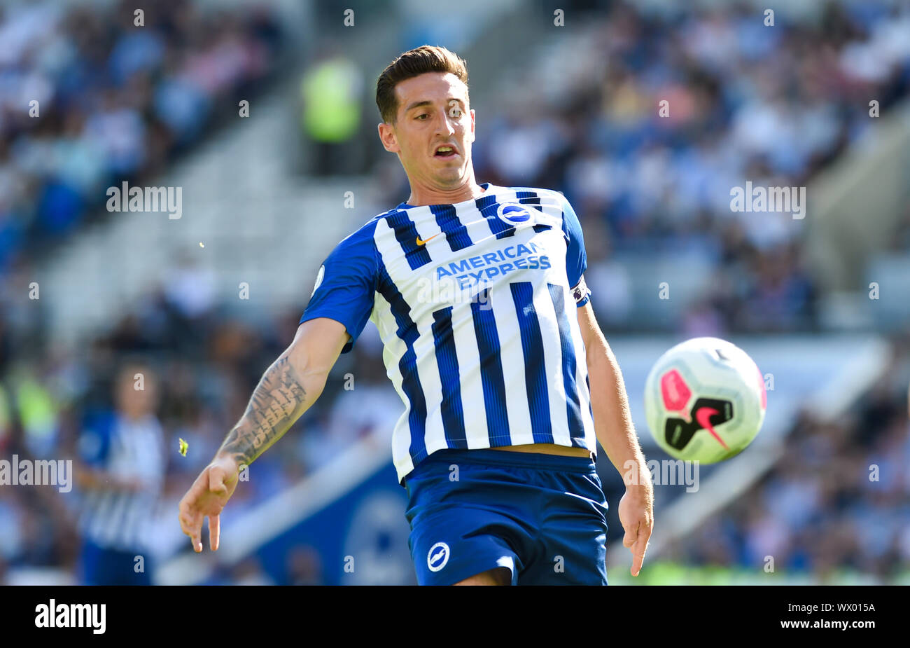 Lewis Dunk of Brighton during the Premier League match between Brighton and Hove Albion and Burnley at the American Express Community Stadium , Brighton , 14 September 2019 Editorial use only. No merchandising. For Football images FA and Premier League restrictions apply inc. no internet/mobile usage without FAPL license - for details contact Football Dataco Stock Photo