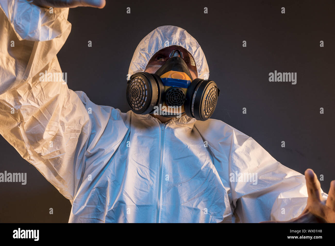 virus infection concept. Man in protective suit and antigas mask with