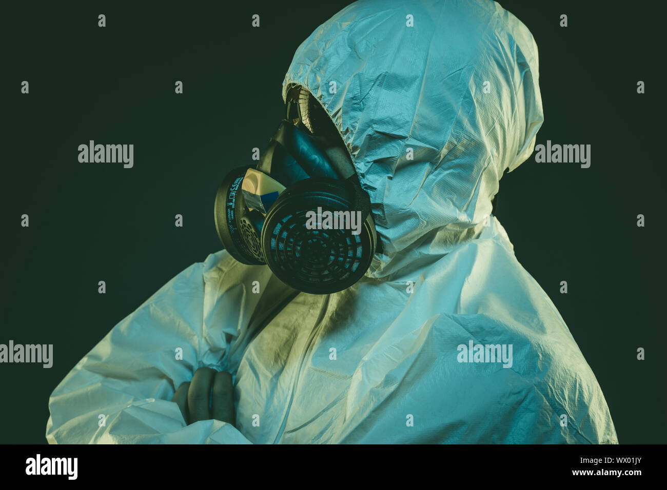 virus infection concept. Man in protective suit and antigas mask with