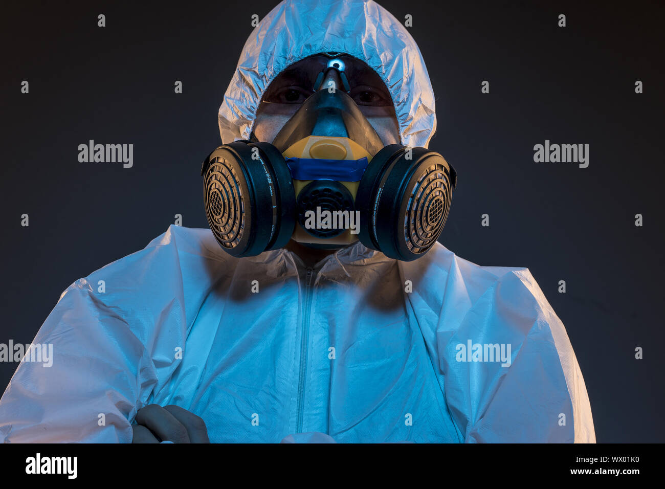 virus infection concept. Man in protective suit and antigas mask with ...