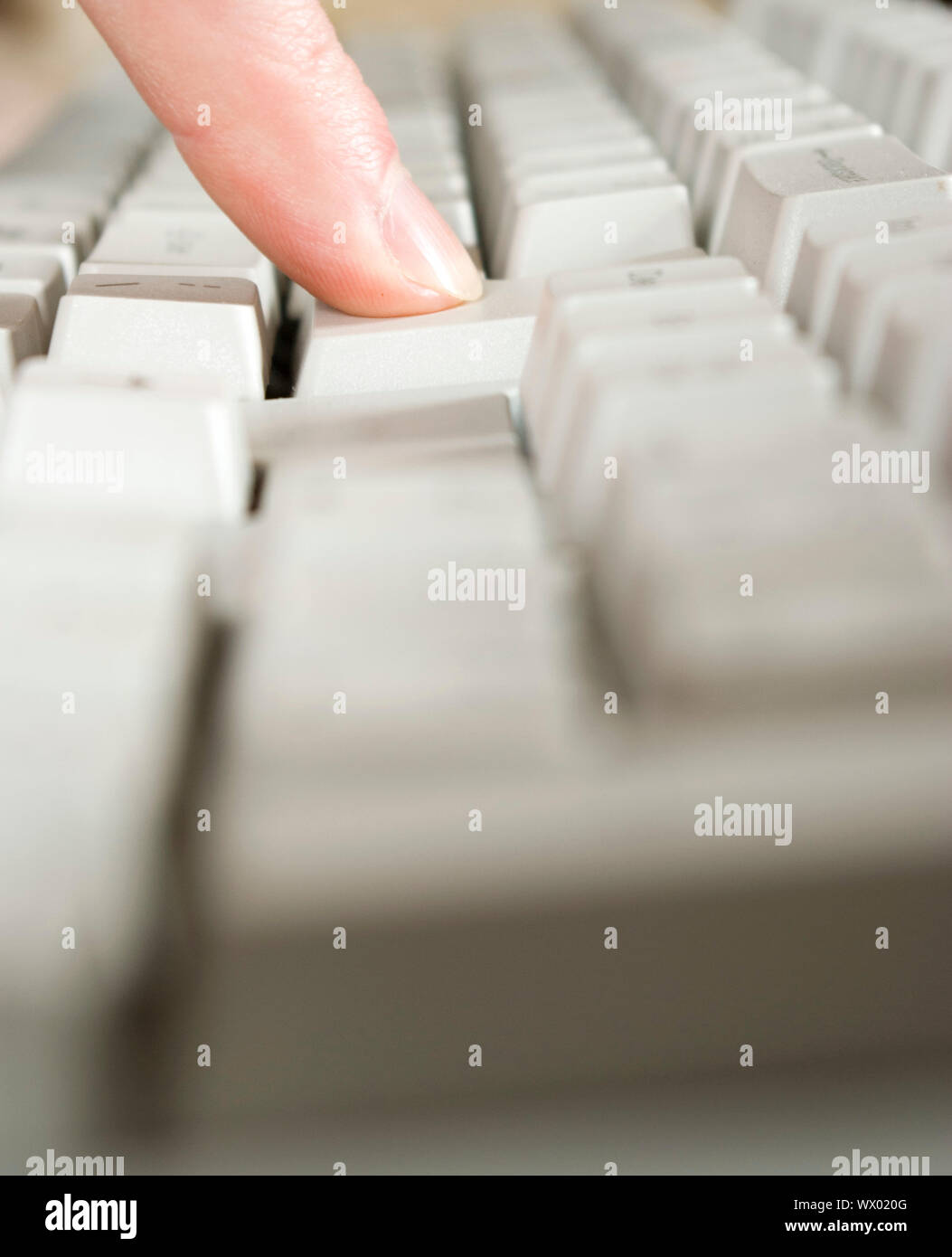 Fingers type a text on the computer keyboard Stock Photo