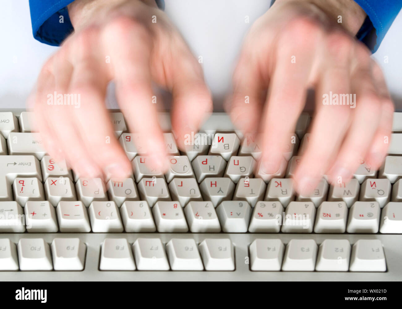 Fingers type a text on the computer keyboard Stock Photo