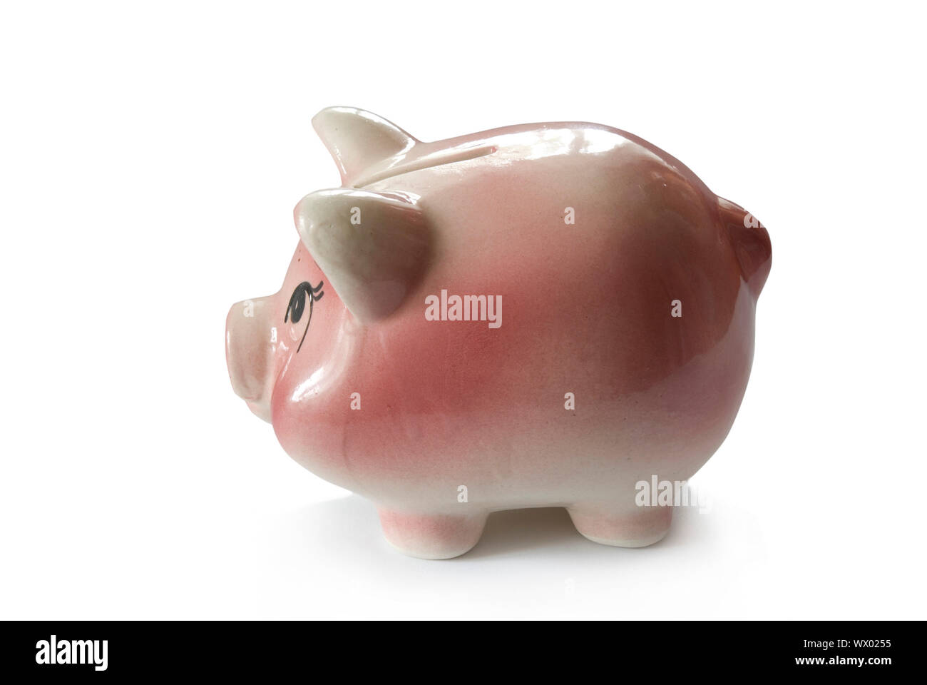 Pink piggy bank isolated on white background with coins Stock Photo - Alamy