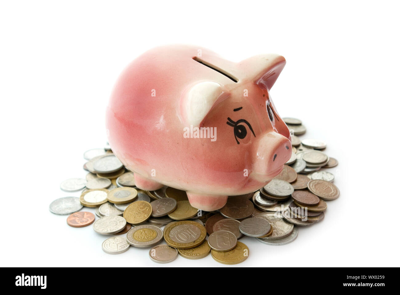 Pink piggy bank isolated on white background with coins Stock Photo - Alamy