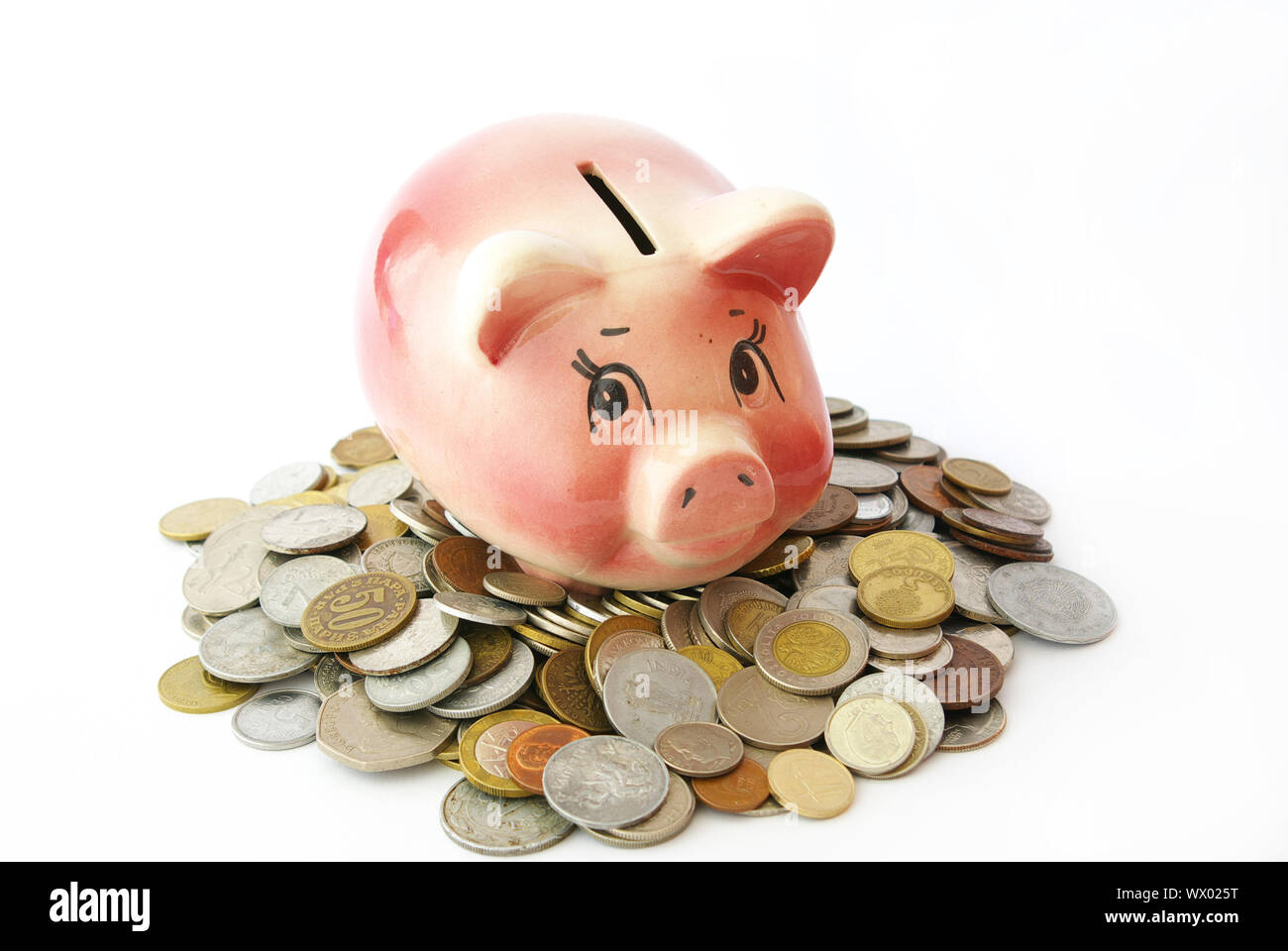 Pink piggy bank isolated on white background with coins Stock Photo - Alamy