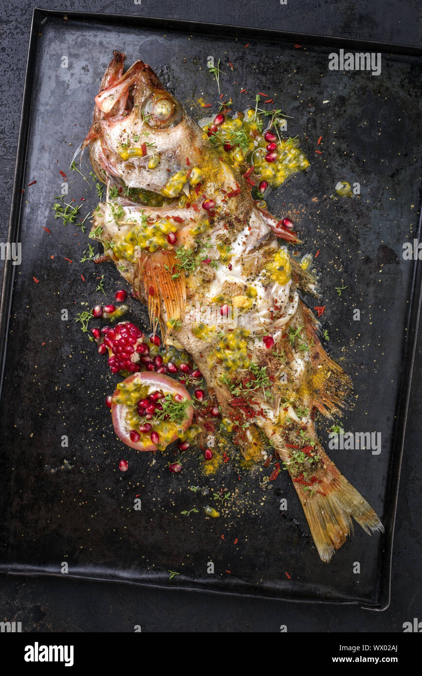 Traditional Australian barbecue rose fish with pomegranate and passion