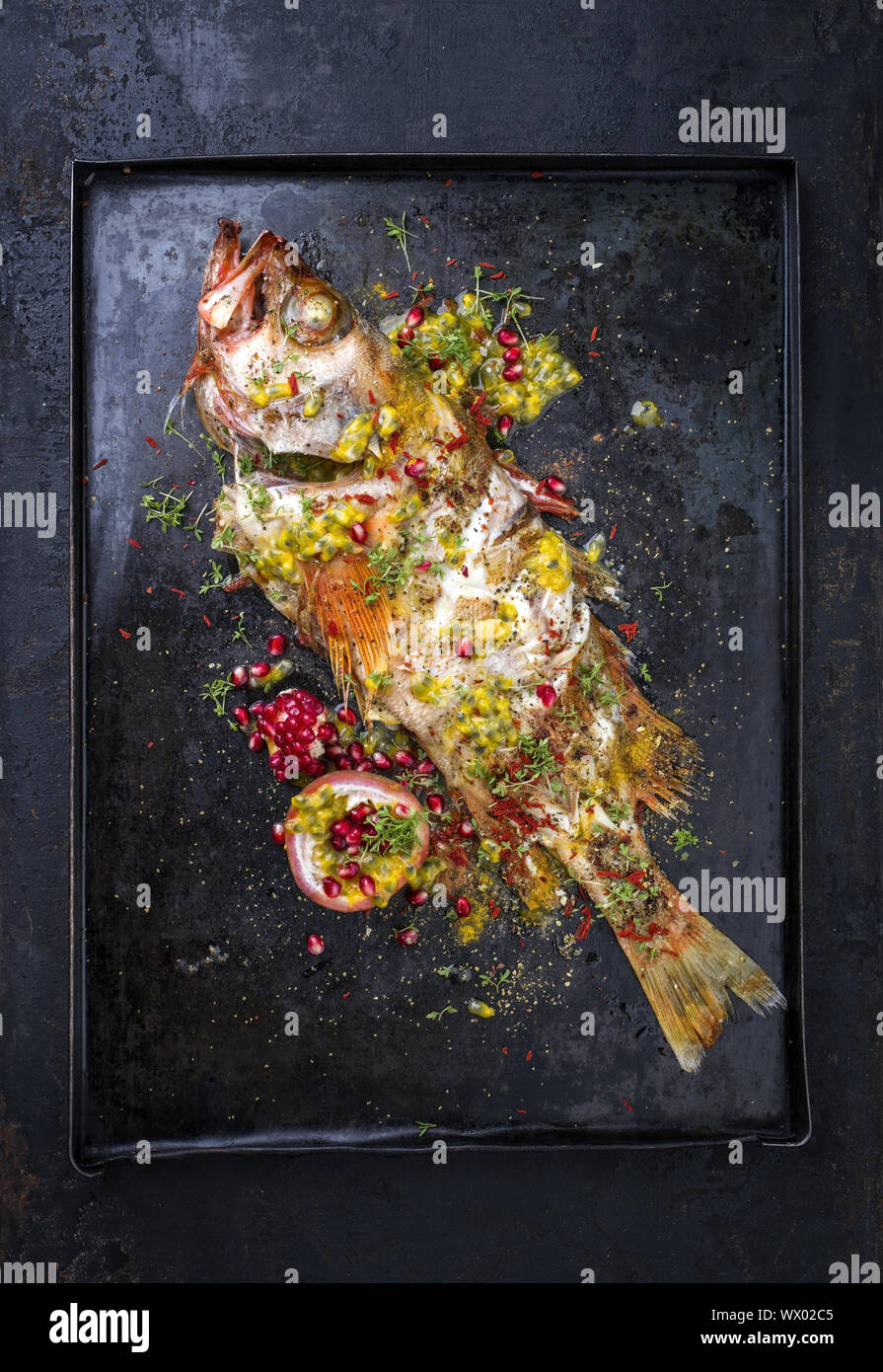 Traditional Australian barbecue rose fish with pomegranate and passion
