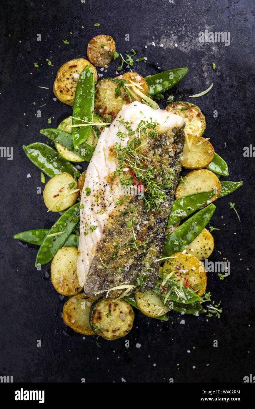 Cod Fish From Top Fried cod fish fillet with vegetable and potatoes as top-view on old ...
