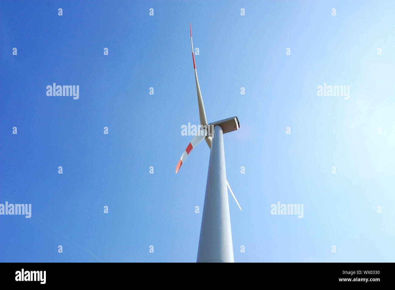 wind turbine under blue sky for alternative energy Stock Photo - Alamy