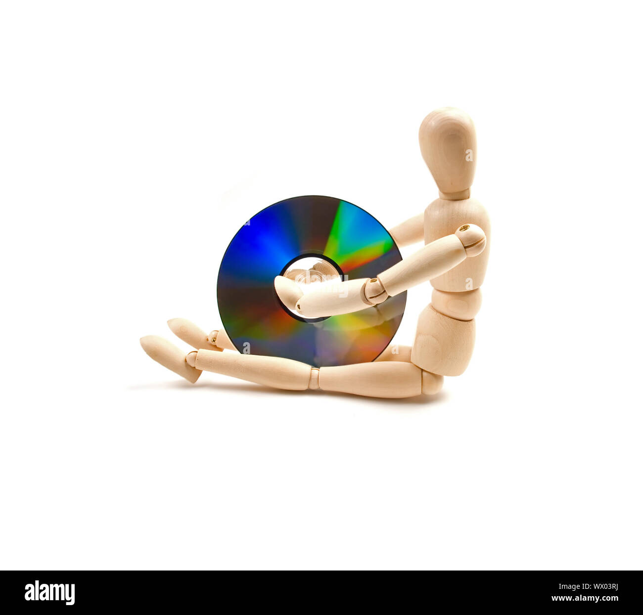 wood mannequin with CD-rom Stock Photo