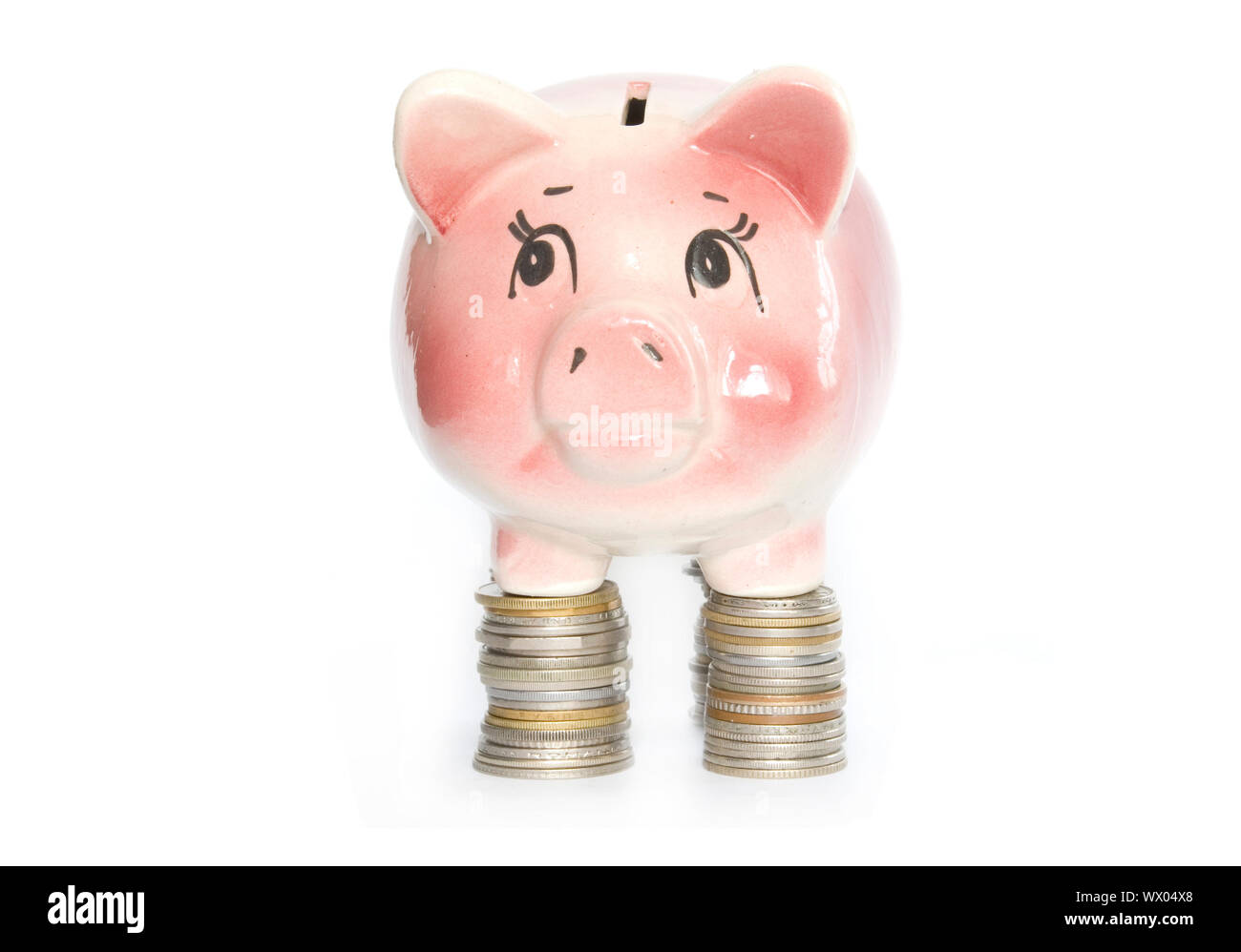 Pink piggy bank isolated on white background with coins Stock Photo - Alamy