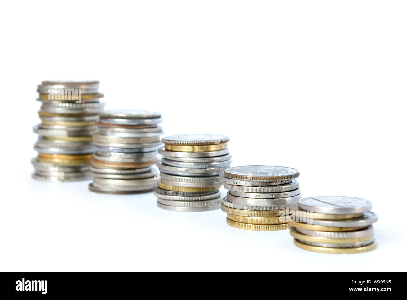 Coin pile isolated on white background Stock Photo - Alamy