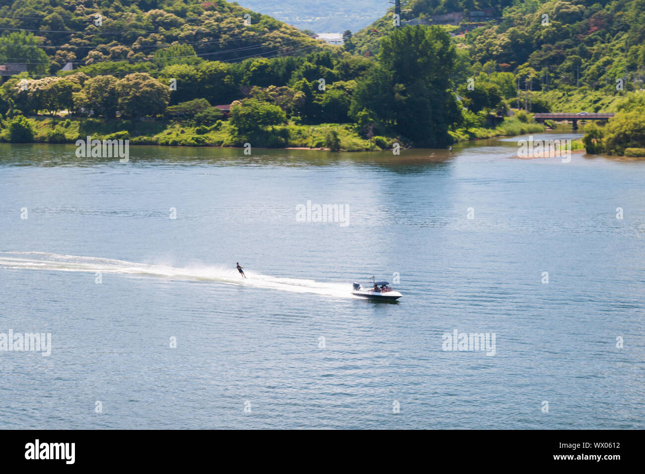 Aerial view photo of high speed water ski towed by speed boat in river, Korea Stock Photo