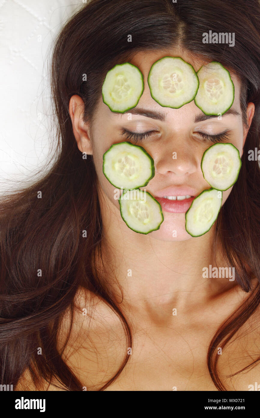 Girls relaxing cucumbers on eyes hires stock photography and images