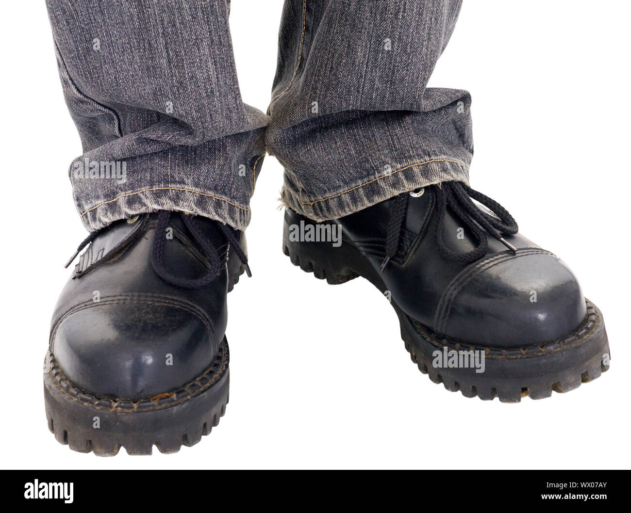 Man's feet in the big black boots on a white background Stock Photo - Alamy