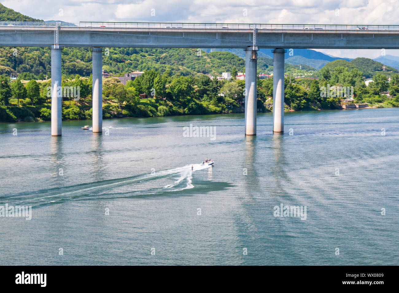 Aerial view photo of high speed water ski towed by speed boat in river, Korea Stock Photo