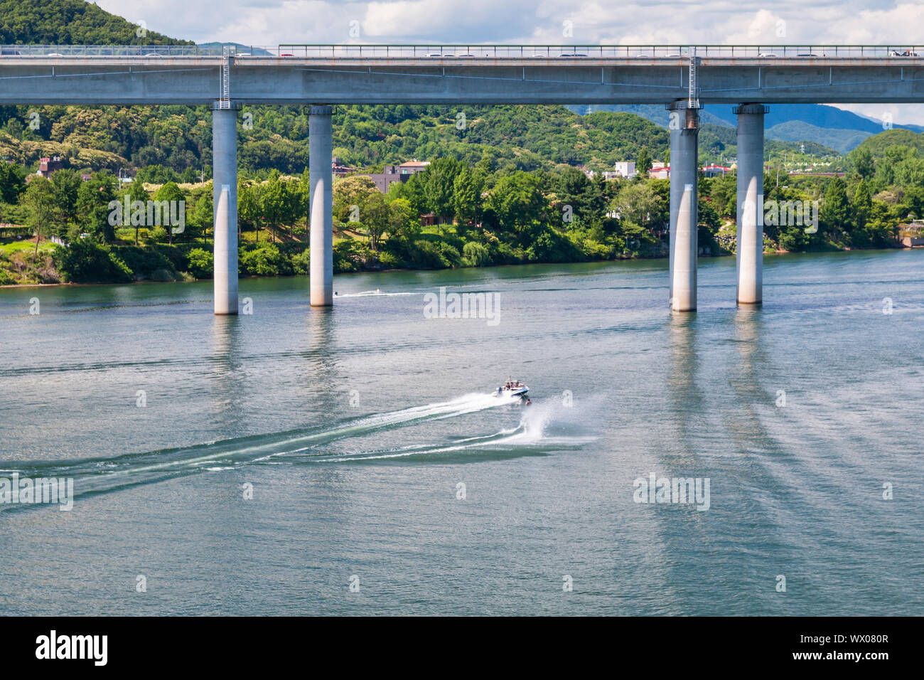 Aerial view photo of high speed water ski towed by speed boat in river, Korea Stock Photo