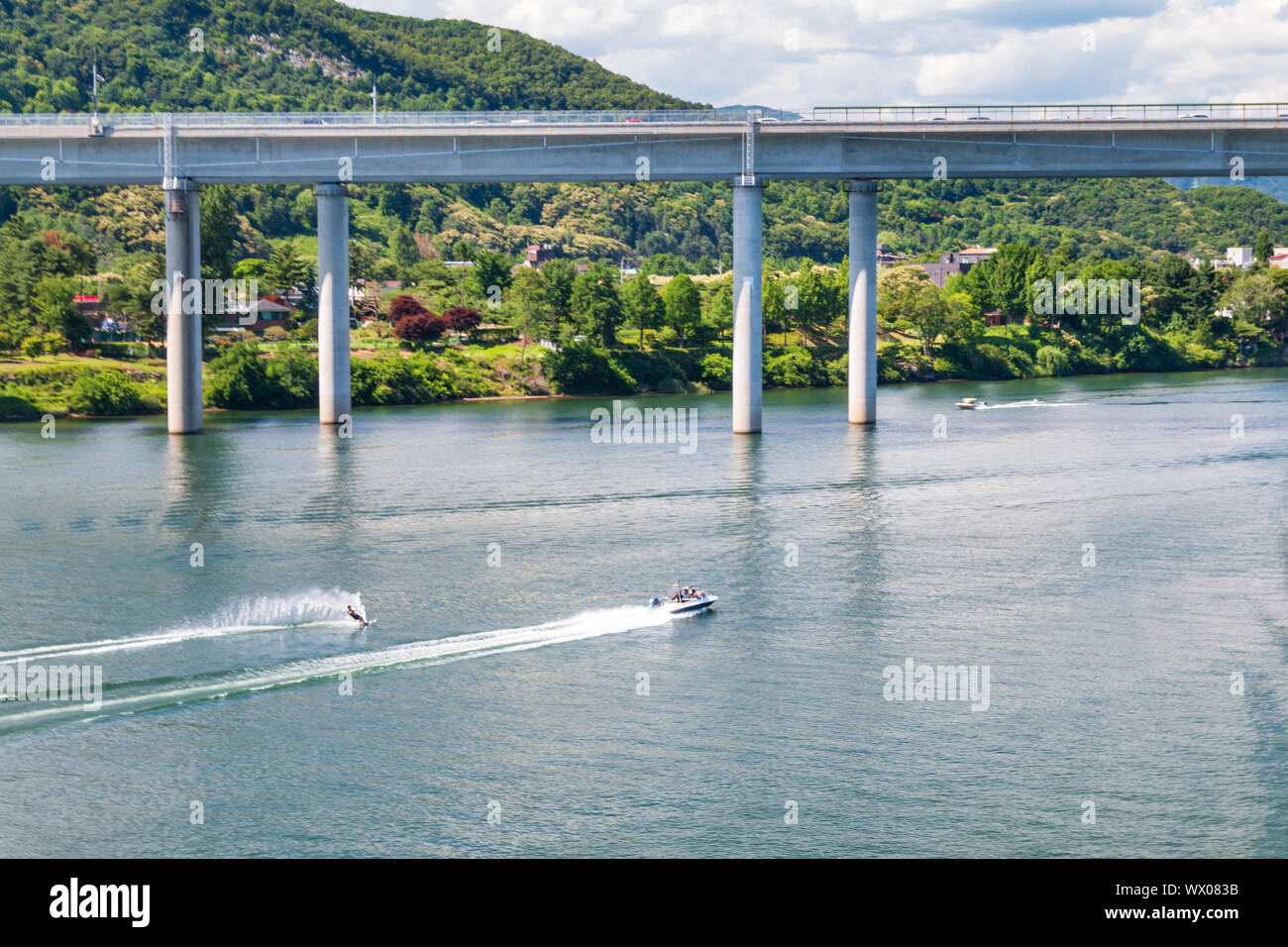 Aerial view photo of high speed water ski towed by speed boat in river, Korea Stock Photo