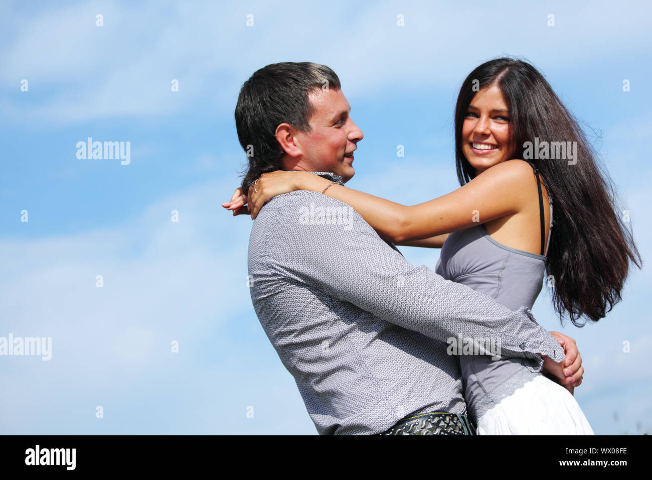 man and woman hug in the sky Stock Photo - Alamy