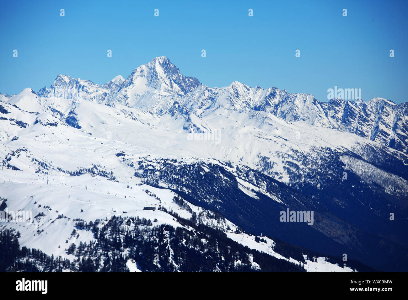 top of mountains sun in blue sky Stock Photo - Alamy