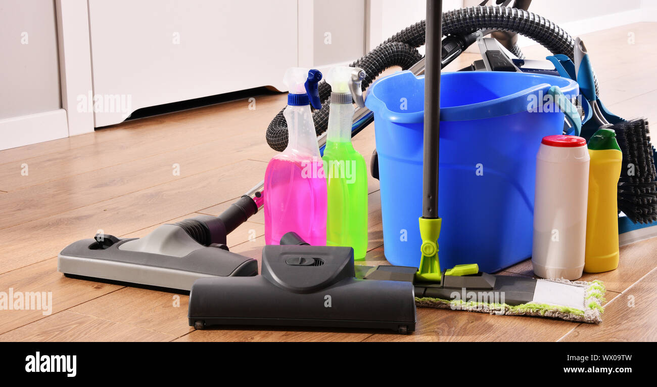 Vacuum cleaner and variety of detergent bottles and chemical cleaning ...