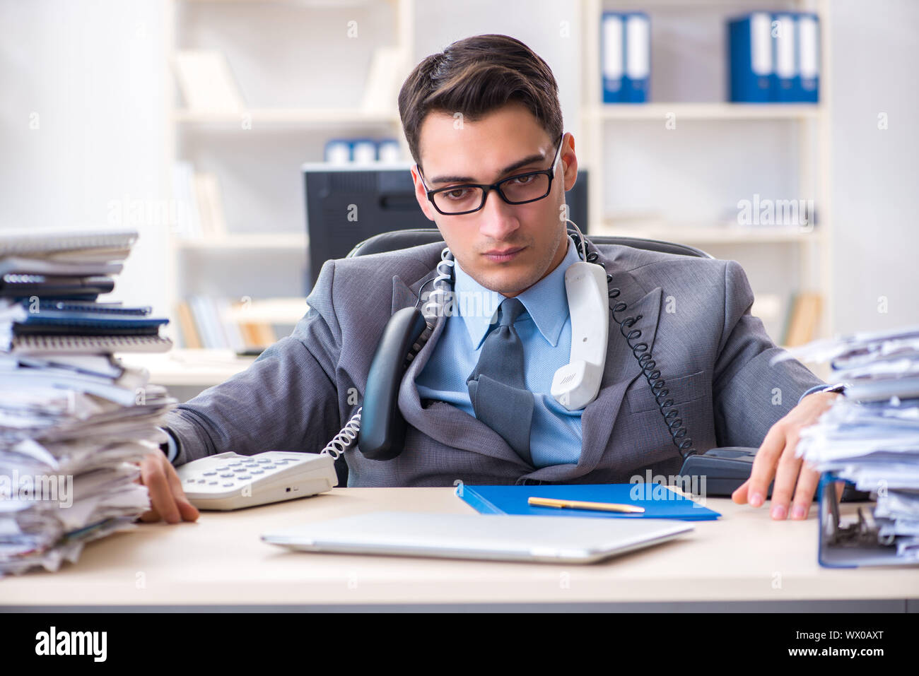 Desperate sad employee tired at his desk in call center Stock Photo - Alamy