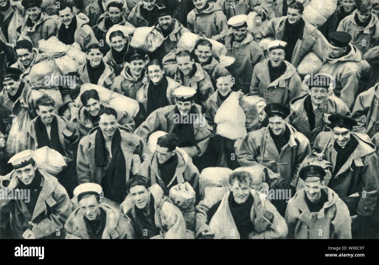 'The Spirit of the Ark', - sailors of the Royal Navy, c1942. A British aircraft carrier of the Second World War, 'HMS Ark Royal' was designed to carry a large number of aircraft, and had two hangar deck levels. She was involved in the first aerial and U-boat kills of the war, in operations off Norway, in the search for the German battleship 'Bismarck', and took part in the Malta Convoys. A German submarine torpedoed her on 13 November 1941 and she sank the following day. Only one of her 1,488 crew members was killed. From &quot;Ark Royal&quot;. [His Majesty's Stationery Office, London, 1942] Stock Photo