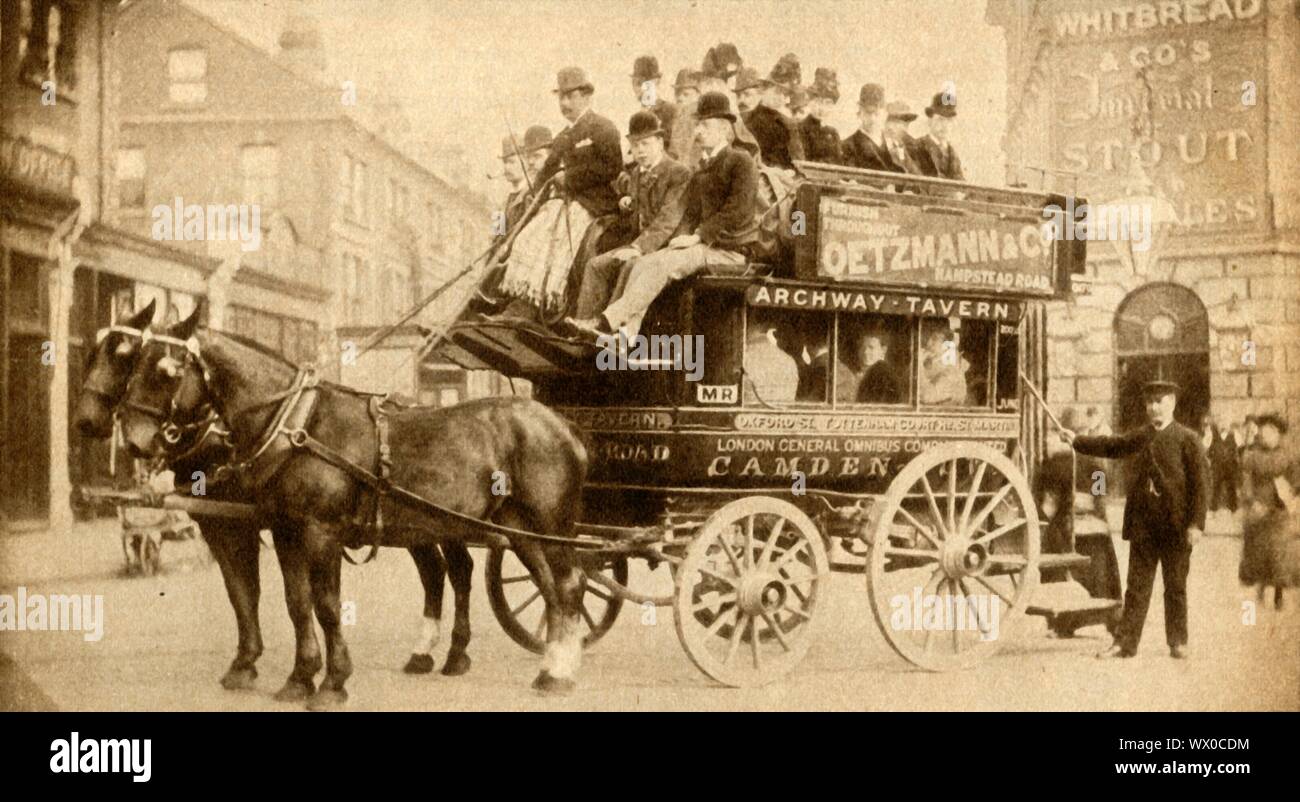 'The Knifeboard Bus', 1900, (1933). Passengers on a London open-top horse-drawn bus, so-called because 'the seat on the top along which the passengers sat back to back...similar to the boards on which the domestic servants of the day had to clean, polish, and sharpen the cutlery of their master's tables'. From &quot;The Pageant of the Century&quot;. [Odhams Press Ltd, 1933] Stock Photo