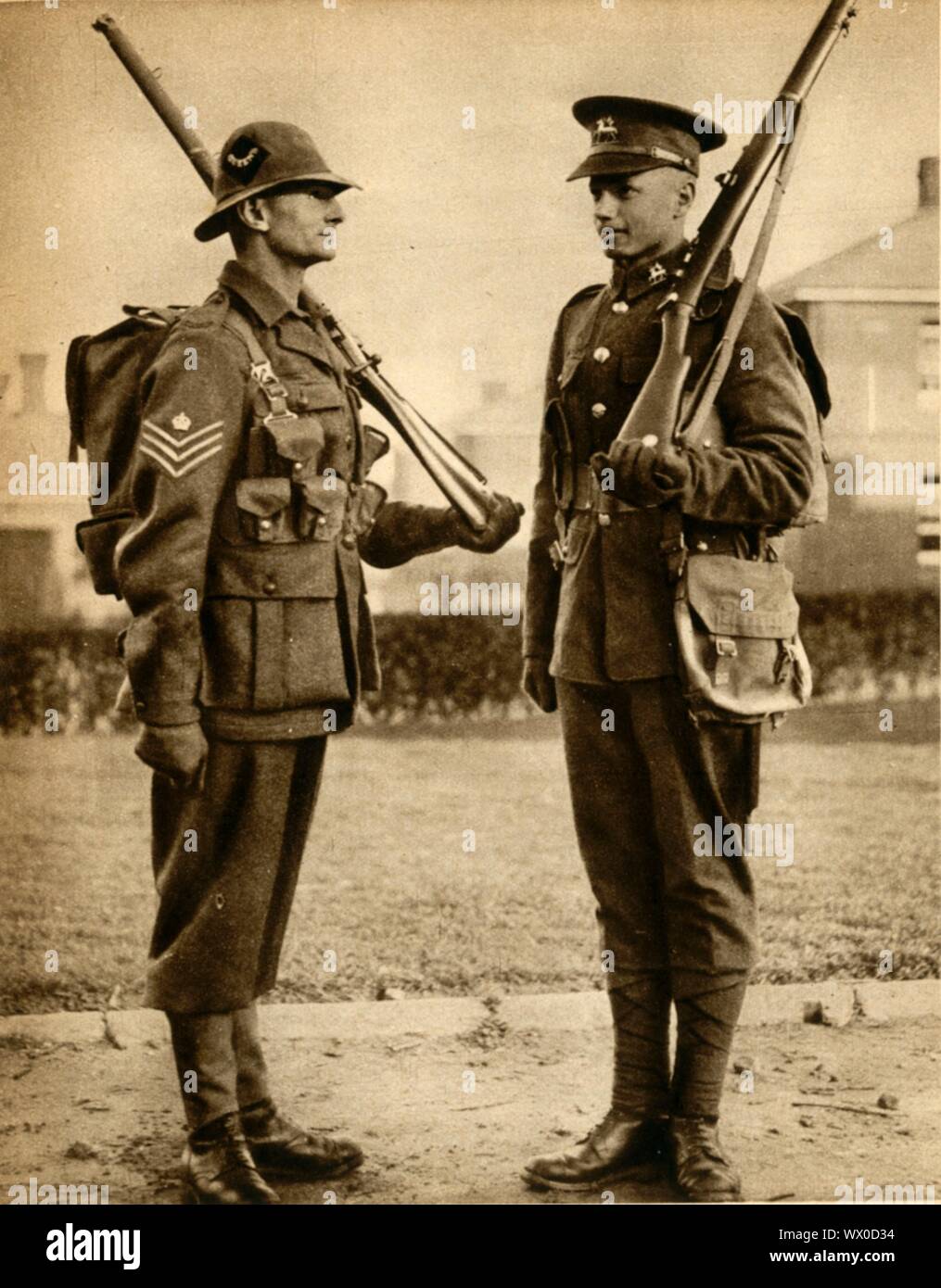 British Army uniforms, 1933. '&quot;Tommy's&quot; New Uniform [left]: The tight &quot;soldierly&quot; collar is replaced by an open-necked shirt: the gleaming buttons....are discarded; the flat pockets of the tunic have turned to &quot;sloppy&quot; pleated patch pockets: the &quot;spiral&quot; puttees have given way to canvas leggings and the tight &quot;pantaloons&quot;...are almost plus fours. To crown everything, the hard-peaked forage cap is replaced by a soft helmet'. From &quot;The Pageant of the Century&quot;. [Odhams Press Ltd, 1933] Stock Photo