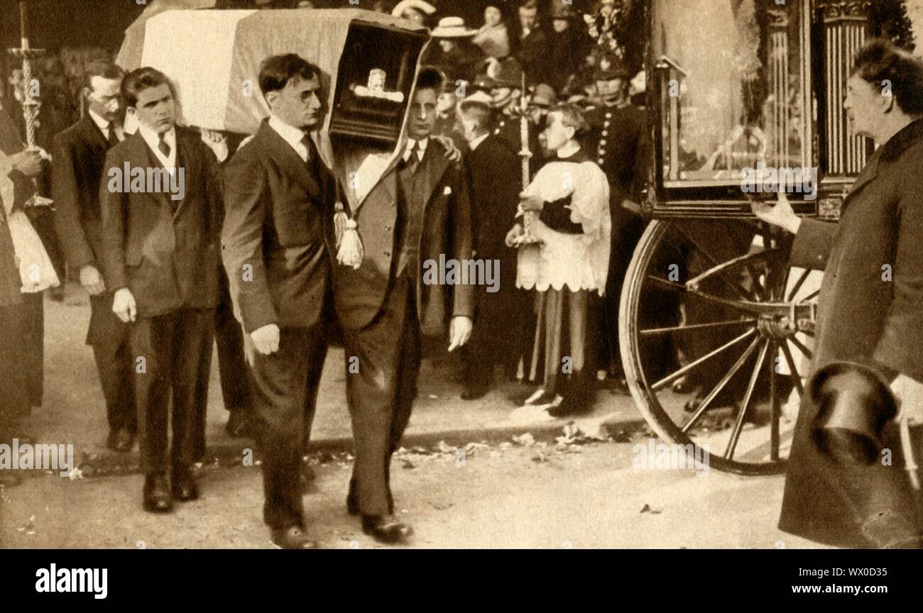 Funeral of Terence MacSwiney, Cork, Ireland, 31 October 1920, (1933). The coffin, wrapped in Sinn F&#xe9;in colours, is carried out of the Cathedral of St Mary and St Anne. MacSwiney (1879-1920), an Irish playwright, author and politician, was elected as Sinn F&#xe9;in Lord Mayor of Cork during the Irish War of Independence in 1920. He was arrested by the British Government on charges of sedition and imprisoned in Brixton Prison. He died there on 25 October 1920 after 74 days on hunger strike. From &quot;The Pageant of the Century&quot;. [Odhams Press Ltd, 1933] Stock Photo