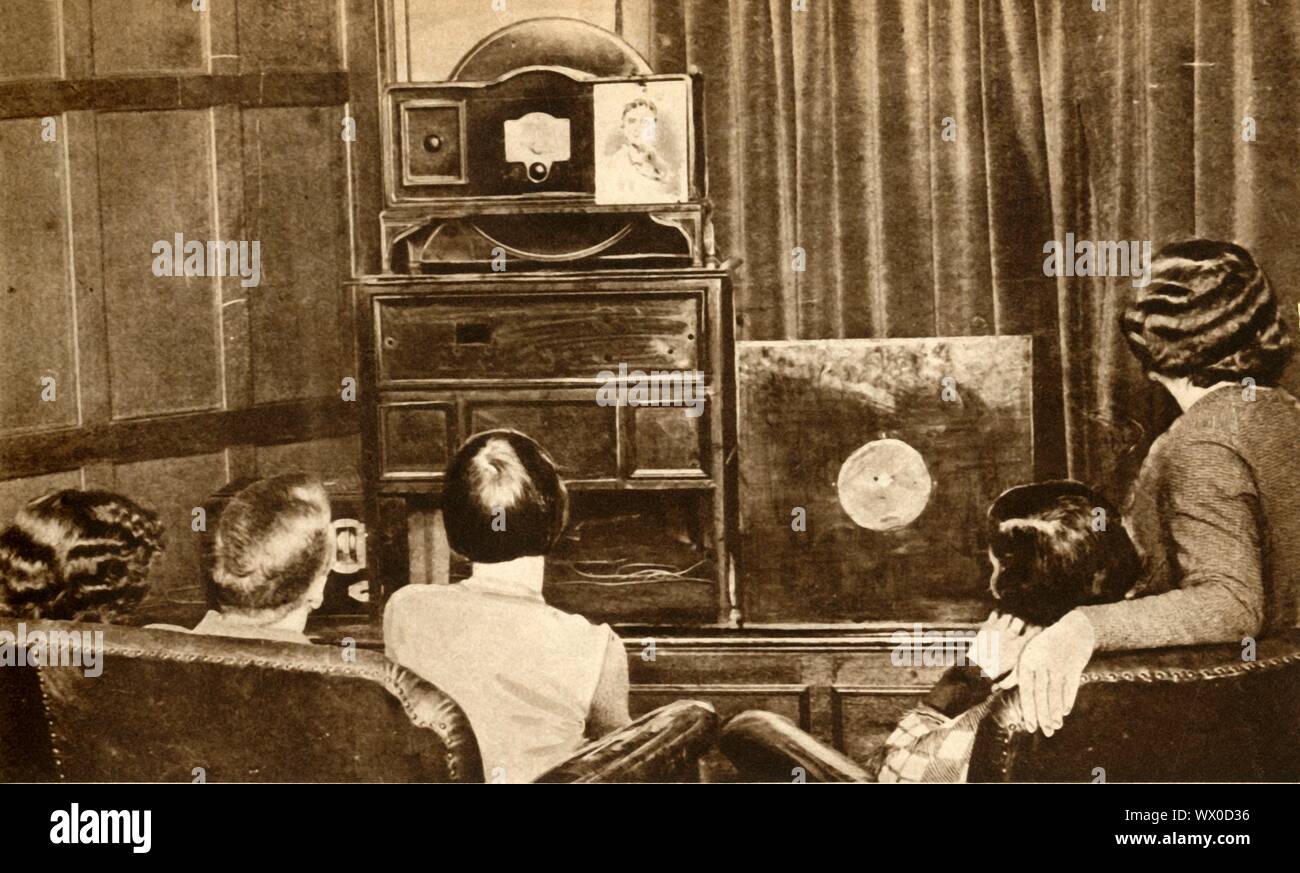People watching an early television broadcast, c1930, (1933