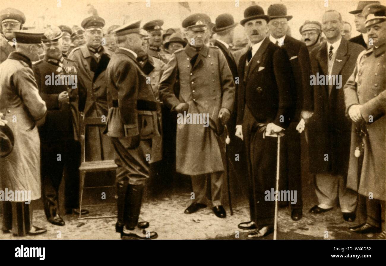 Franz von Papen and Kurt von Schleicher, 1932, (1933). 'Herr Von Papen, the Junker Chancellor of Germany at the crisis...with General Schleicher, his right-hand man, at a review of the &quot;troops&quot; of the Steel Helmets, one of Germany's patriotic organisations'. German Chancellor Franz von Papen (1879-1969) and General von Schleicher (1882-1934) who succeeded him as chancellor. Von Schleicher was in turn succeeded by Adolf Hitler. From &quot;The Pageant of the Century&quot;. [Odhams Press Ltd, 1933] Stock Photo