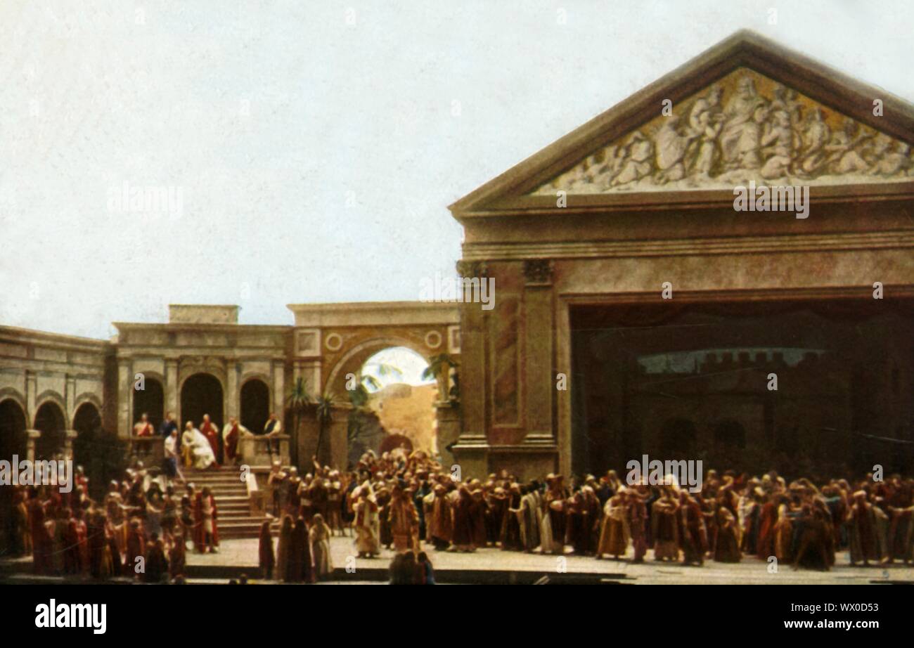 Players on stage in the Oberammergau Passion Play, 1922. The play is performed every 10 years, on open-air stages, by the inhabitants of the village of Oberammergau in Bavaria, Germany. First staged in 1634, the play tells the story of Jesus' passion, culminating in his crucifixion. The event has become a tourist attraction, with audiences coming from all over the world. Official postcard of the 1922 Oberammergau Passion Play. [F. Bruckmann, Munich, Germany, 1922] Stock Photo