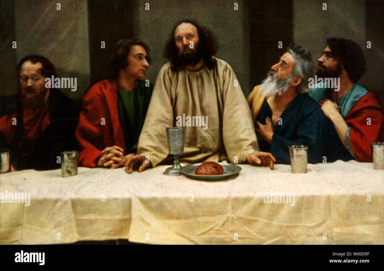 The Last Supper, 1922. Jesus predicts that one of his Apostles present at the meal will betray him, despite their assertions to the contrary. Melchior Breitsamter as St John, Anton Lang as Jesus, Andreas Lang as St Peter: players in the Oberammergau Passion Play which is performed every 10 years, on open-air stages, by the inhabitants of the village of Oberammergau in Bavaria, Germany. First staged in 1634, the play tells the story of Jesus' passion, culminating in his crucifixion. The event has become a tourist attraction, with audiences coming from all over the world. Official postcard of th Stock Photo