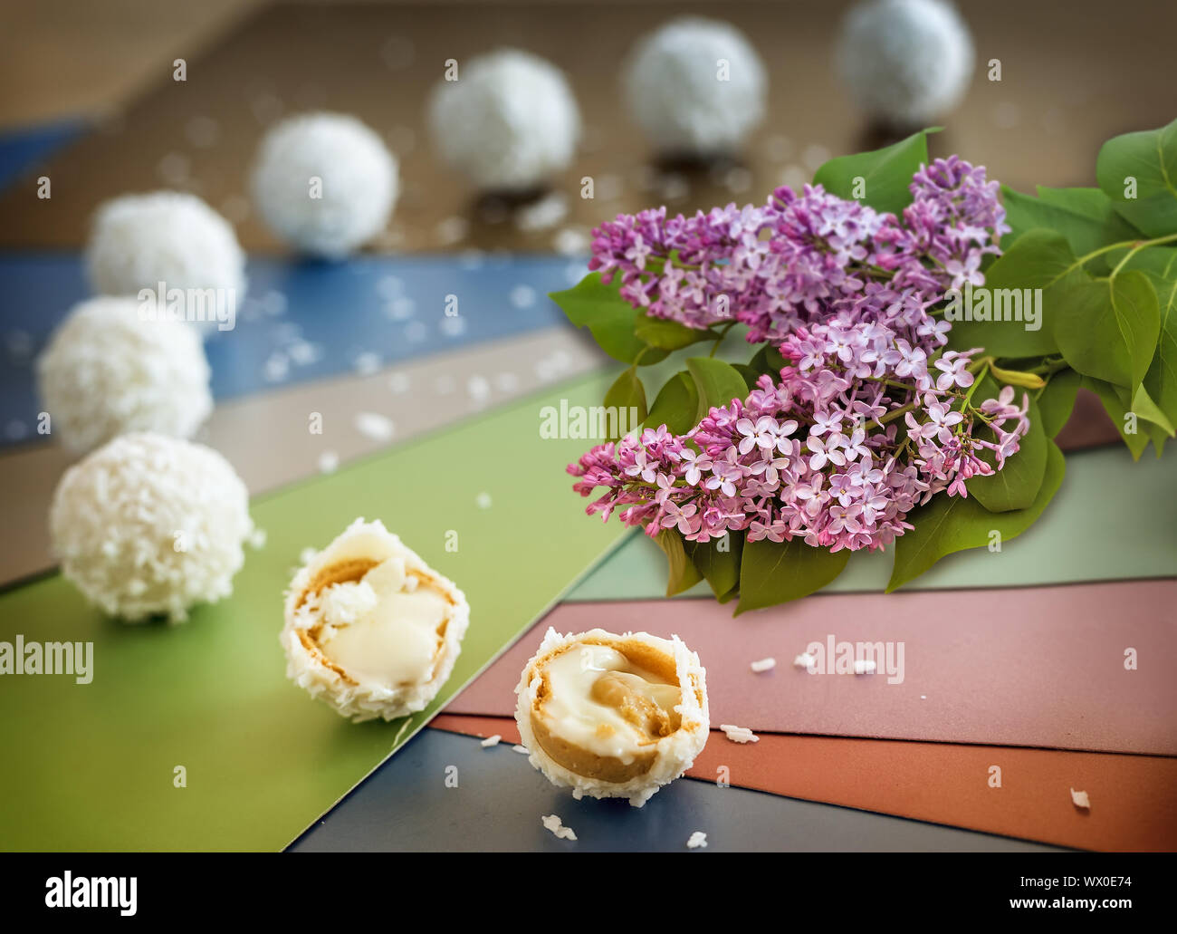 Still life: delicious cookies and a branch of flowering lilac. Stock Photo