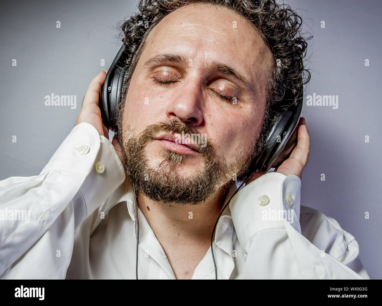 classical music, man with intense expression, white shirt Stock Photo