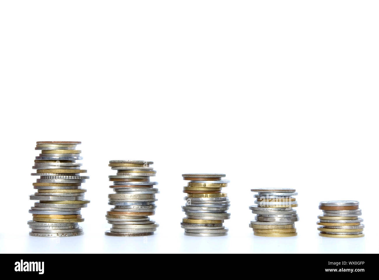 Coin pile isolated on white background Stock Photo - Alamy