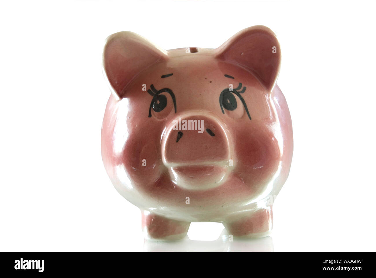 Pink piggy bank isolated on white background with coins Stock Photo - Alamy