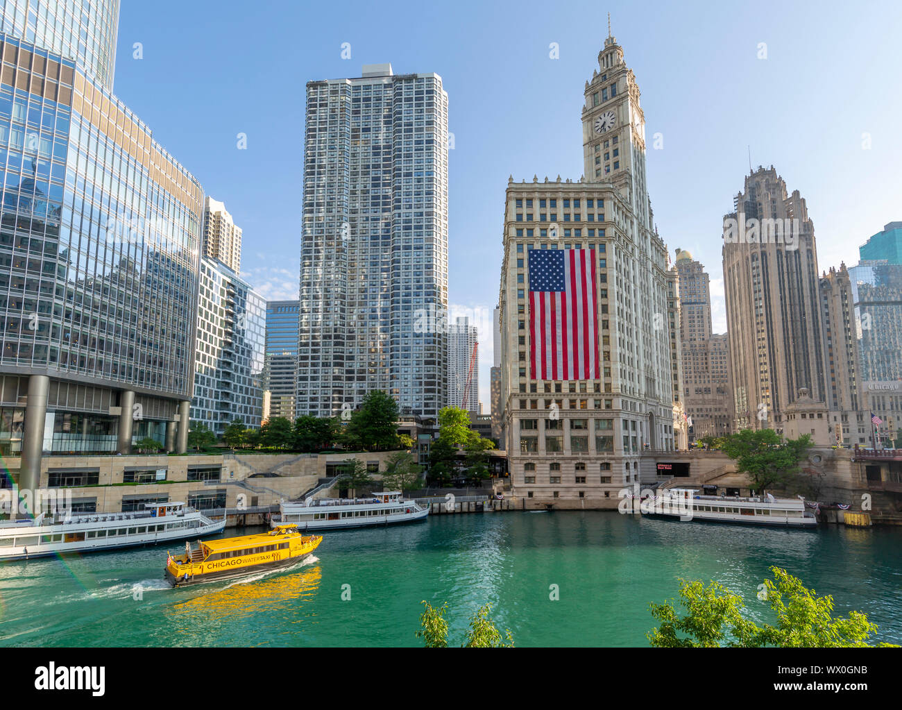 View of The Wrigley Building, Chicago River and watertaxi from DuSable Bridge, Chicago, Illinois, United States of America, North America Stock Photo