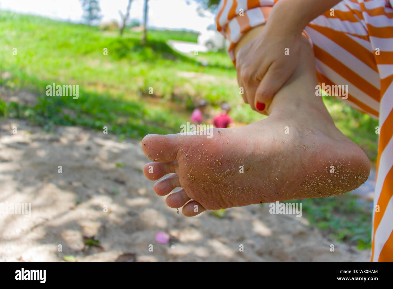 Closeup of woman bare foot suffering from painful toes. after walking