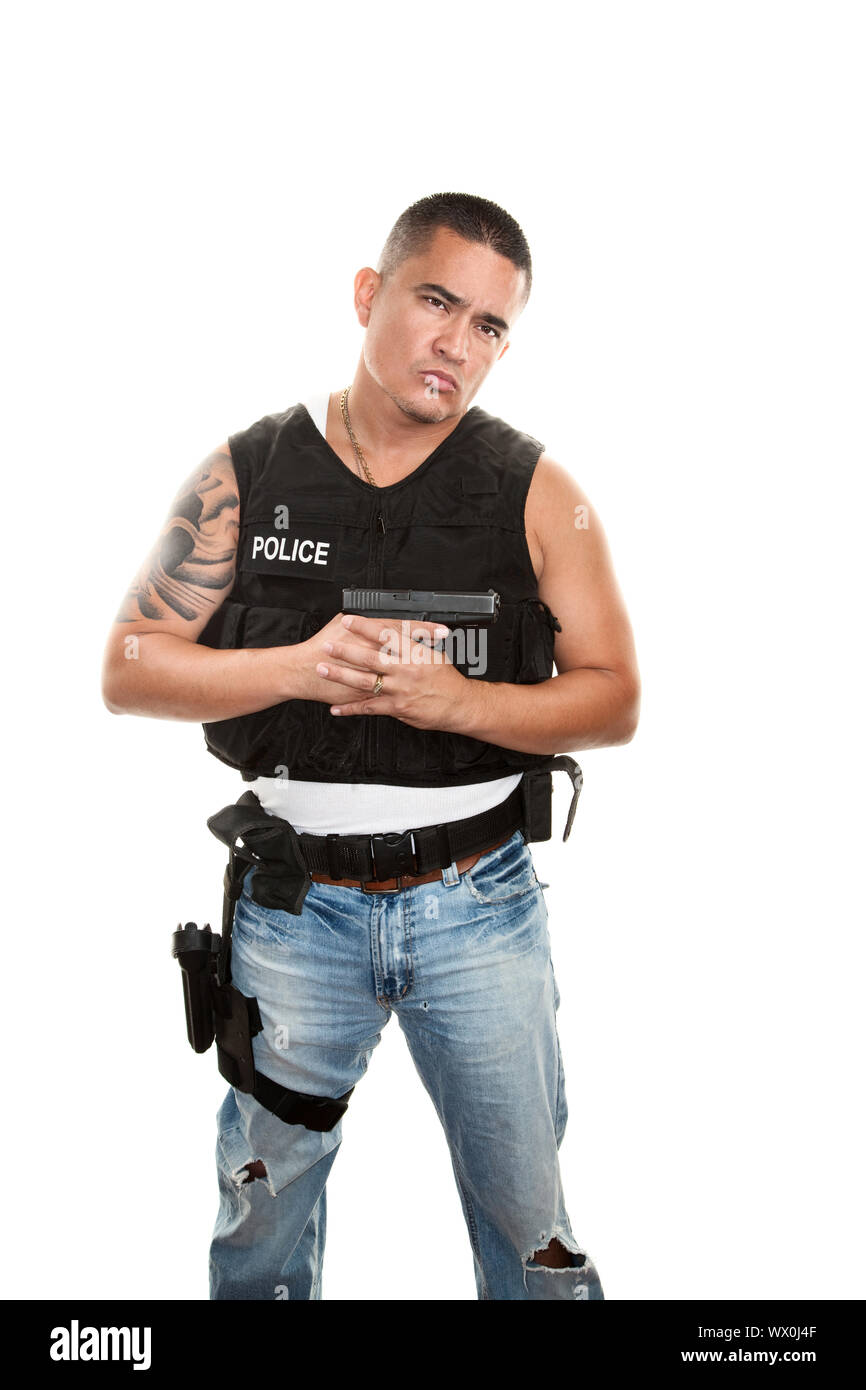 Hispanic cop in plain clothes and bulletproof vest with pistol Stock Photo