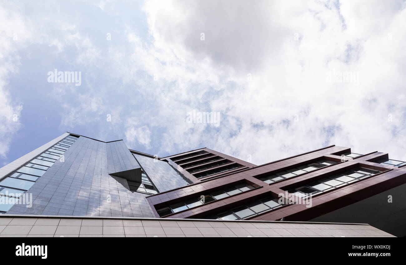 Bottom view of luxury building facade in sky background, real estate ...