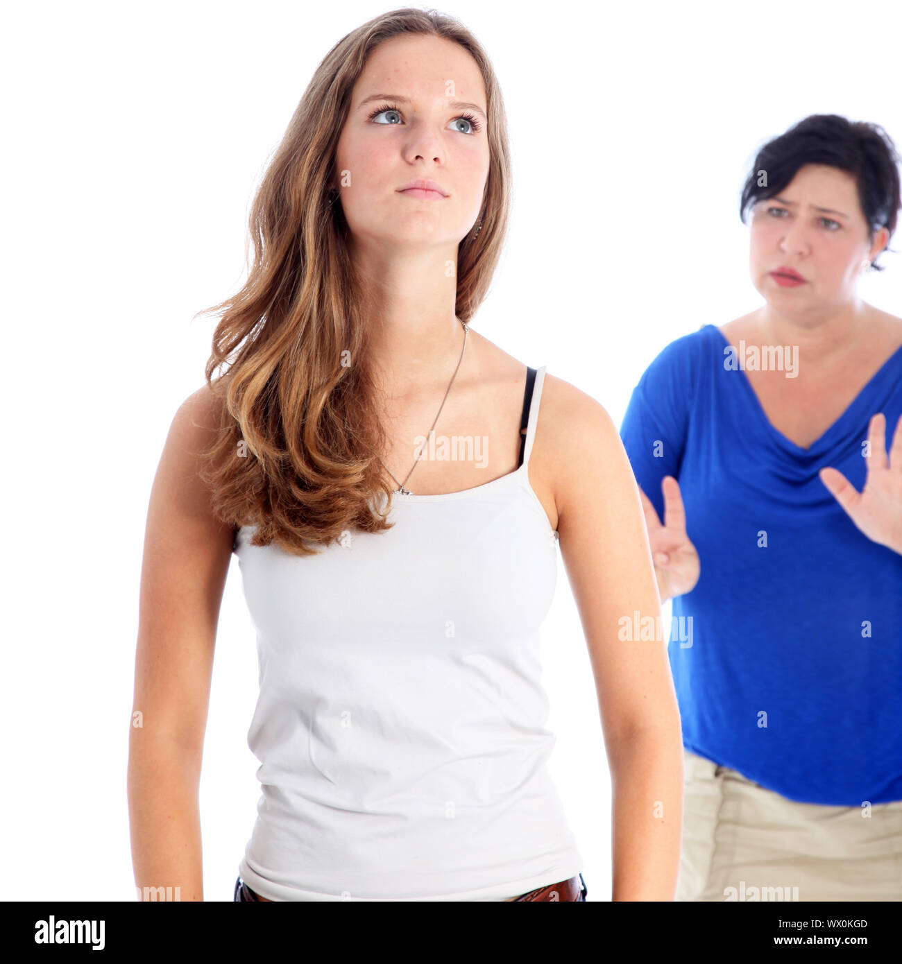 Mother arguing with her daughter who has her head held high with a