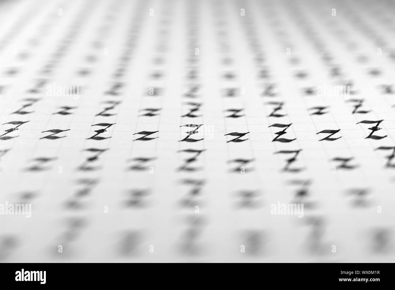 Calligraphy black and white letters Z background. Lettering practice writing worksheet. Handwriting symbol filling pattern. Calligraphic letter z lear Stock Photo