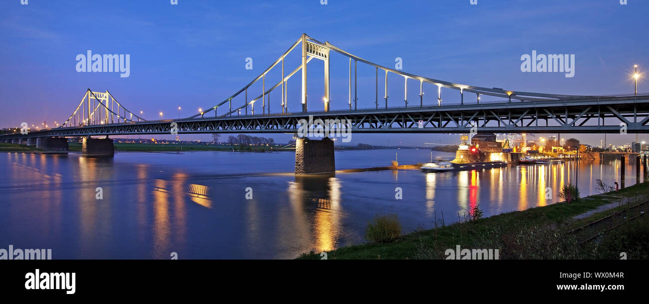 Rhine river bridge with Rhine harbor in the evening, Krefeld, Lower Rhine, Germany, Europe Stock Photo