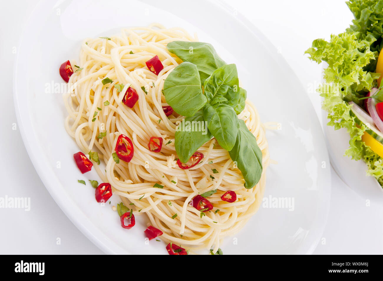 fresh pasta with chilli and basil isolated Stock Photo