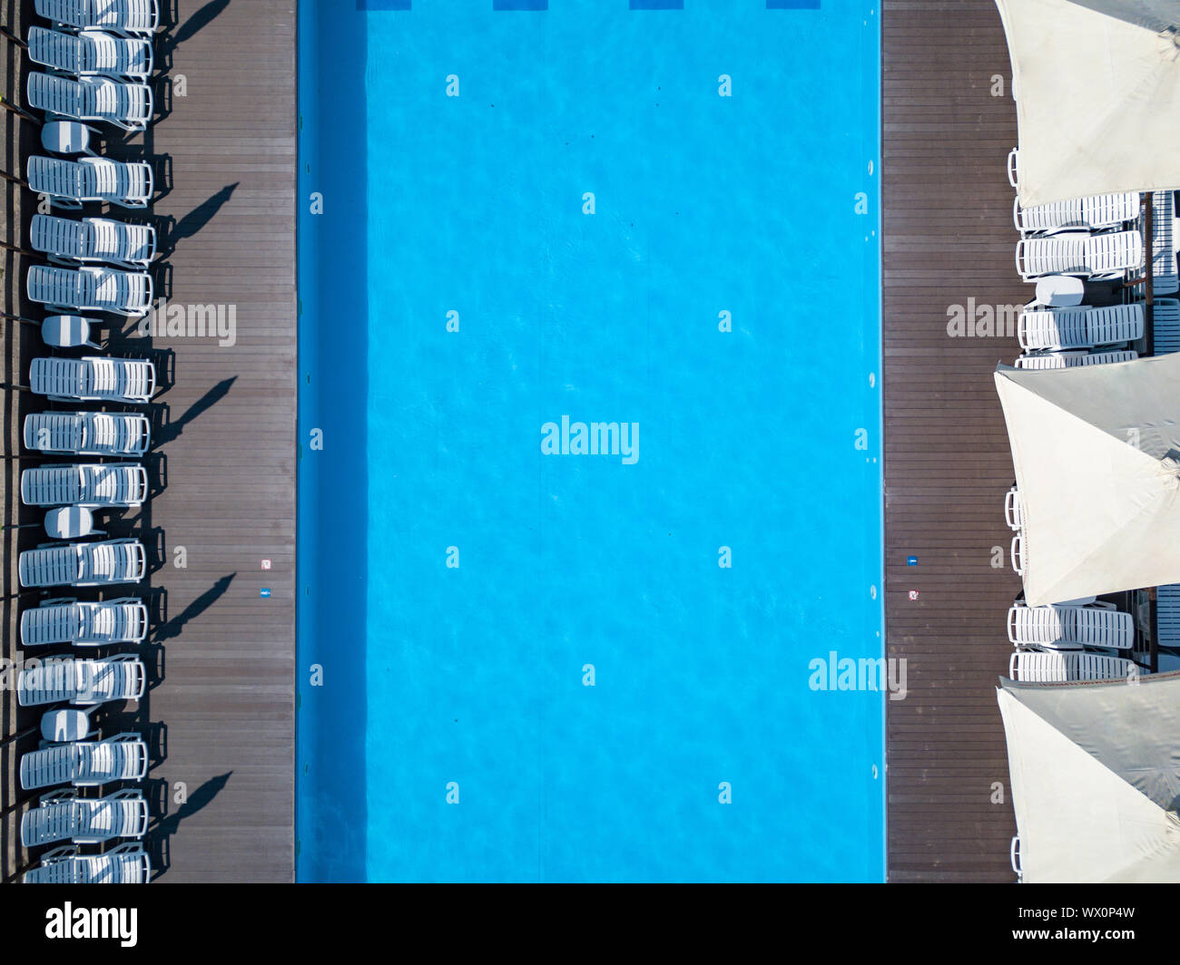 A top view swimming pool with beds and umbrellas in garden Stock Photo ...