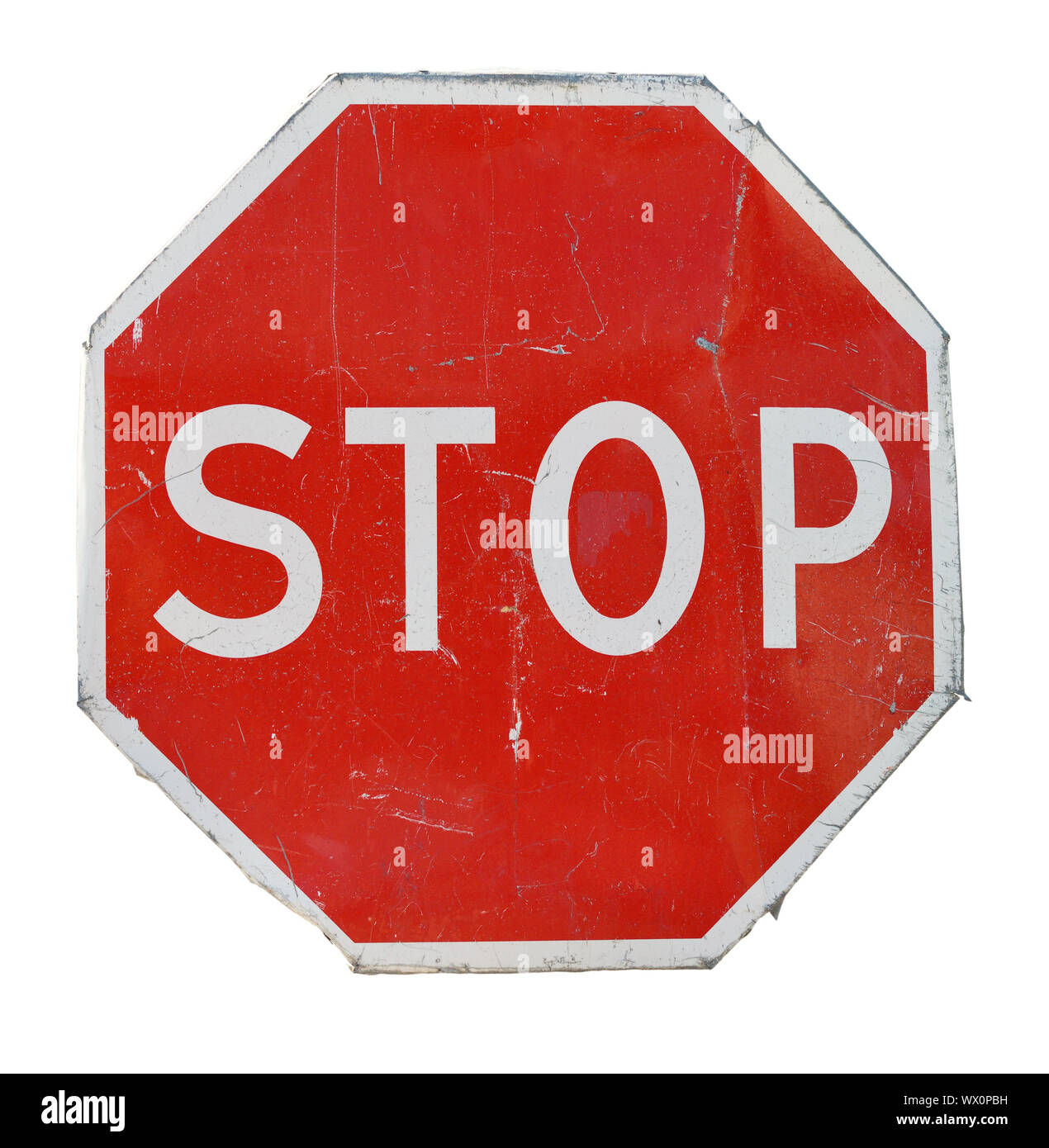 Old red stop road sign isolated on white background Stock Photo