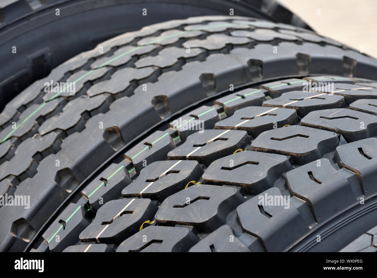 Big truck wheel a black tires closeup Stock Photo